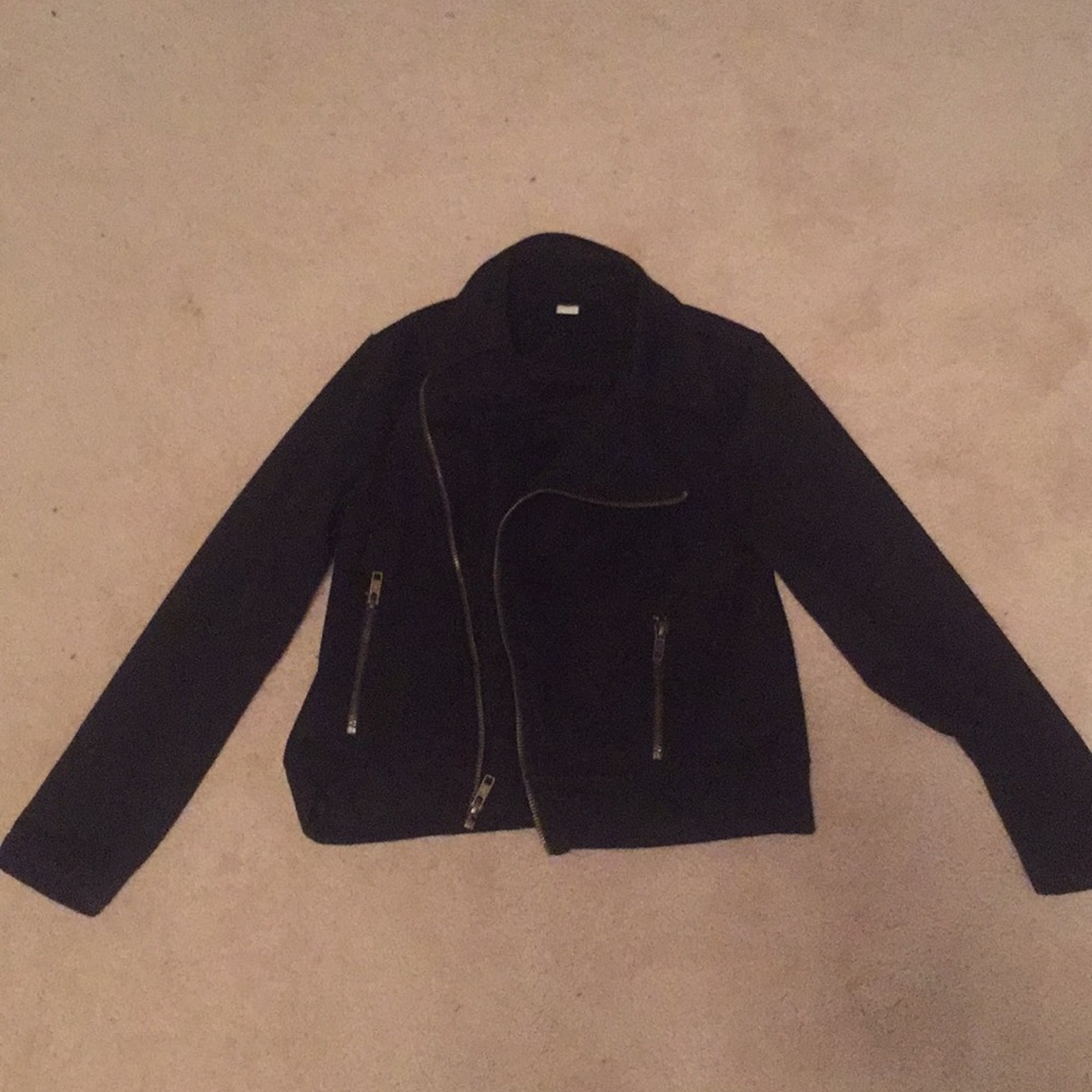 A black zip up with pockets.